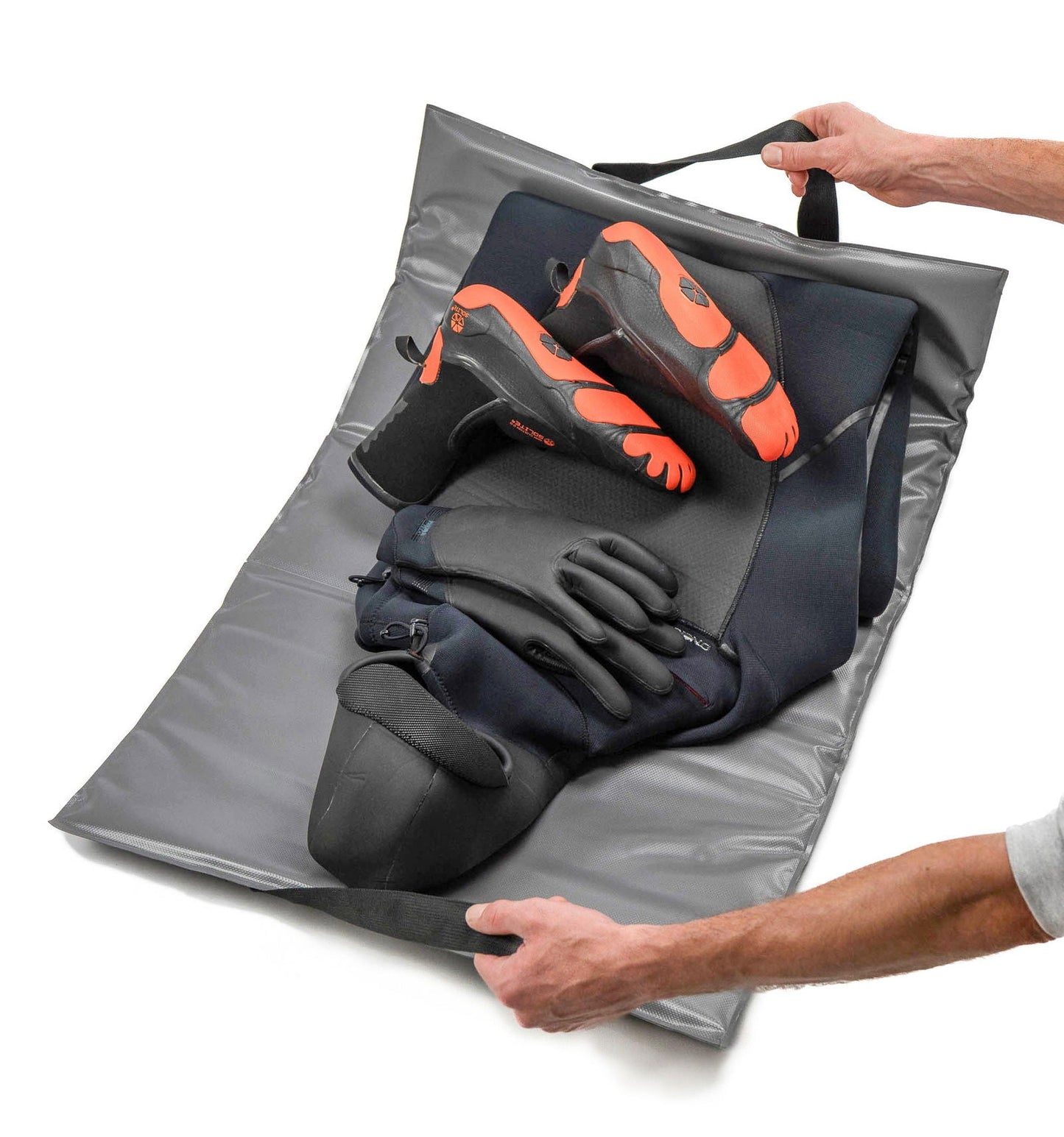 C-Monsta changing mat – lifestyle shot showing wetsuit gloves and booties being loaded onto the mat